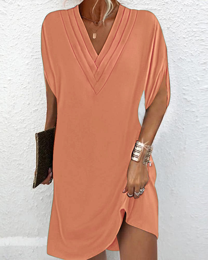 De Paris™ | Robe élégante à manches fendues de couleur unie